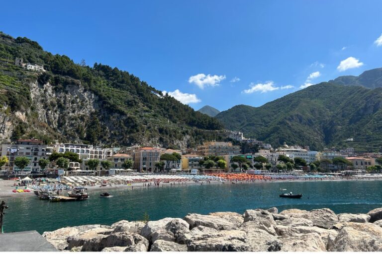 Maiori beach and waterfront surrounded by mountains on the Amalfi Coast