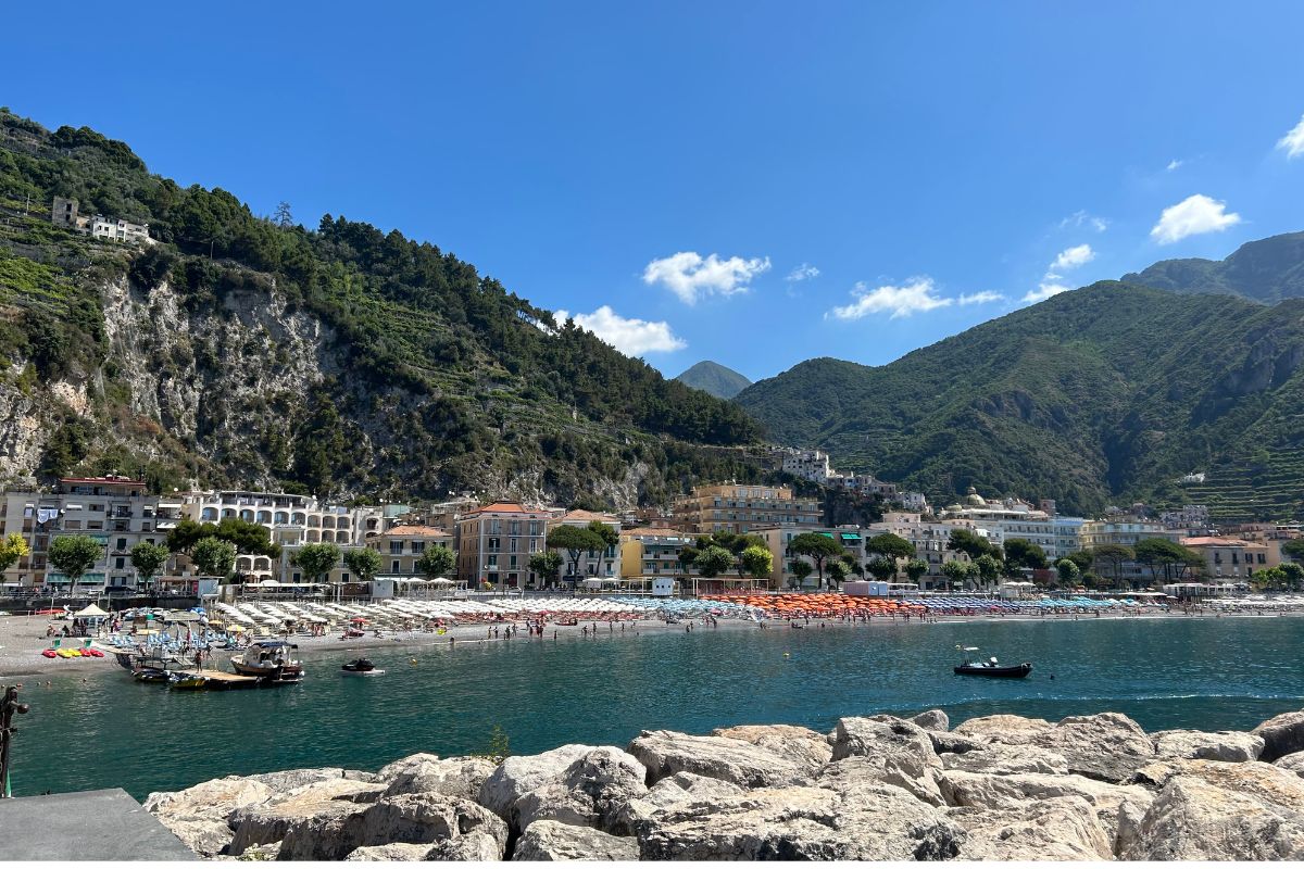 Maiori beach and waterfront surrounded by mountains on the Amalfi Coast