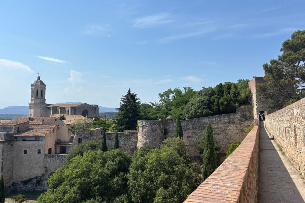 View of Girona Cathedral and the medieval city walls from the historic wall walk in Girona, Spain