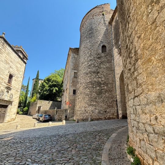 Medieval tower and historic stone streets in Girona's Old Town