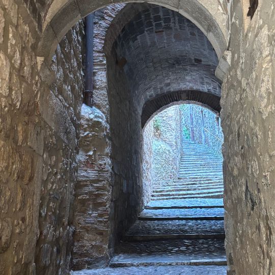 Narrow stone passageway in Girona's medieval Old Town