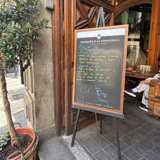 Daily lunch menu displayed outside a restaurant in Madrid