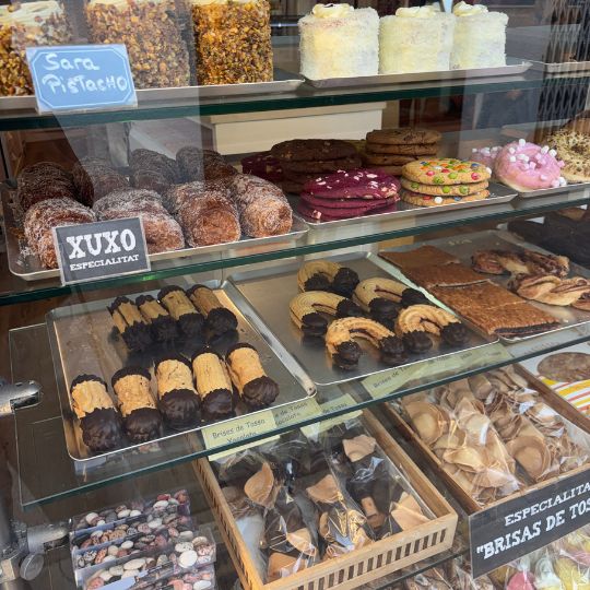 Traditional pastries and local sweets displayed in a bakery in Tossa de Mar