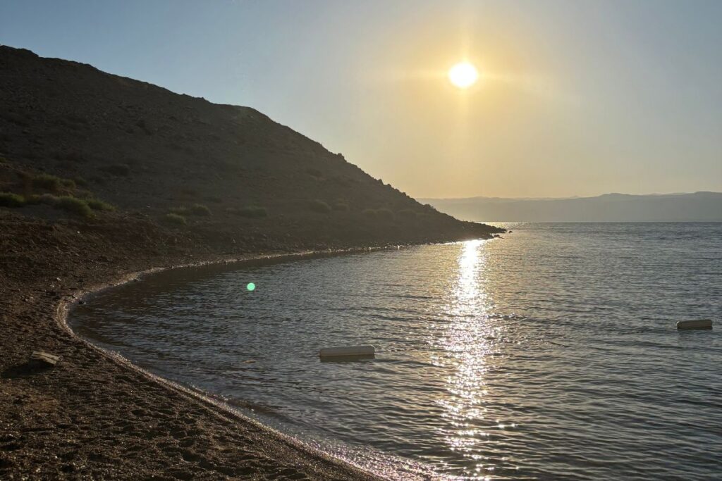 Sunset over the Dead Sea from the shoreline access at Hilton Dead Sea Resort in Jordan