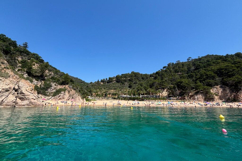 Turquoise waters and sandy beach at Cala Giverola on Spain's Costa Brava