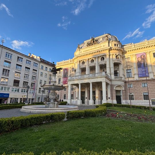 Historic Slovak National Theatre building in Bratislava illuminated by late afternoon sunlight