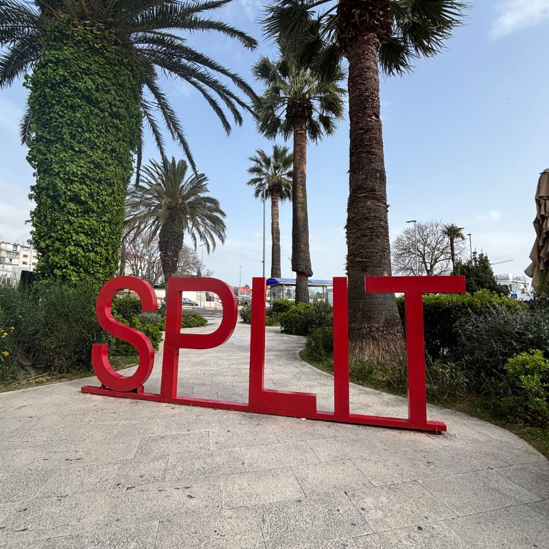 Red Split sign along the waterfront promenade in Split, Croatia.