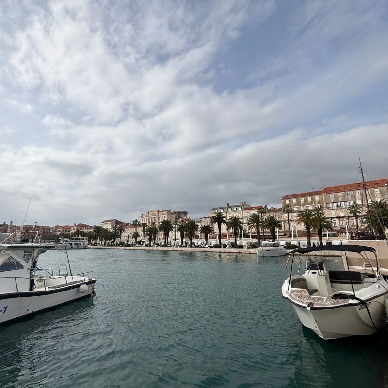 Boats moored in Split Harbor along the waterfront in Croatia.