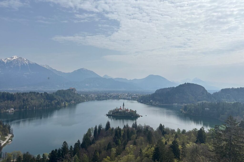 Panoramic view of Lake Bled, Bled Island, Bled Castle, and the Julian Alps in Slovenia.