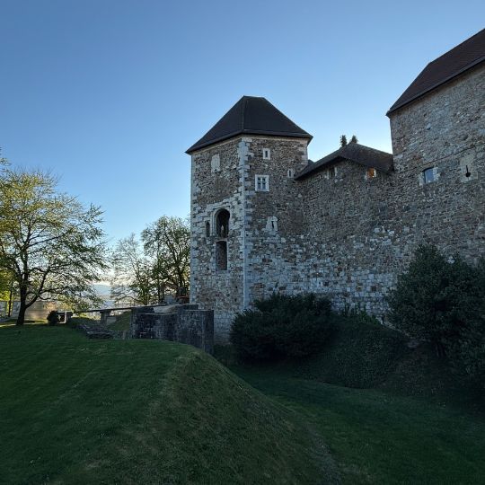 Stone walls and towers of Ljubljana Castle overlooking the city.