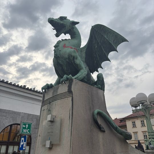 Dragon statue on Ljubljana's famous Dragon Bridge, one of the city's most recognizable landmarks.
