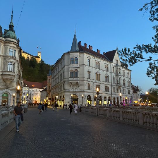 Historic buildings and pedestrian streets in Ljubljana's Old Town at sunset