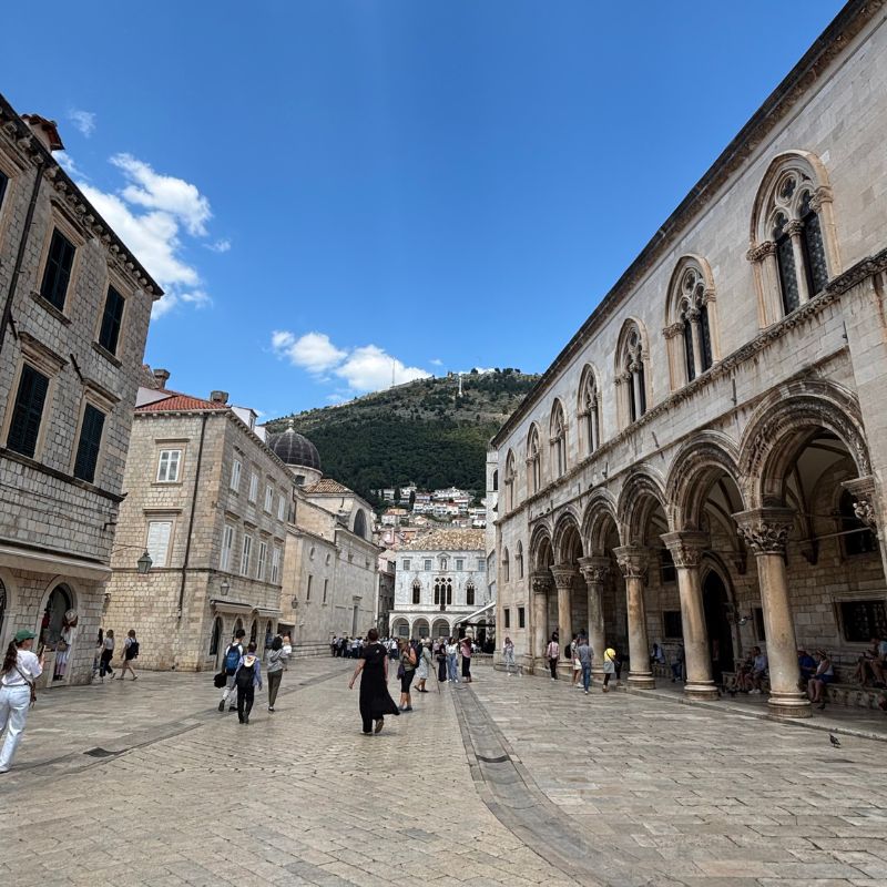 Historic stone buildings and open square in the heart of Dubrovnik Old Town