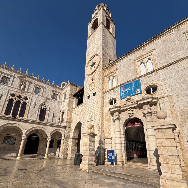 Clock tower and historic buildings in Luža Square in Dubrovnik Old Town