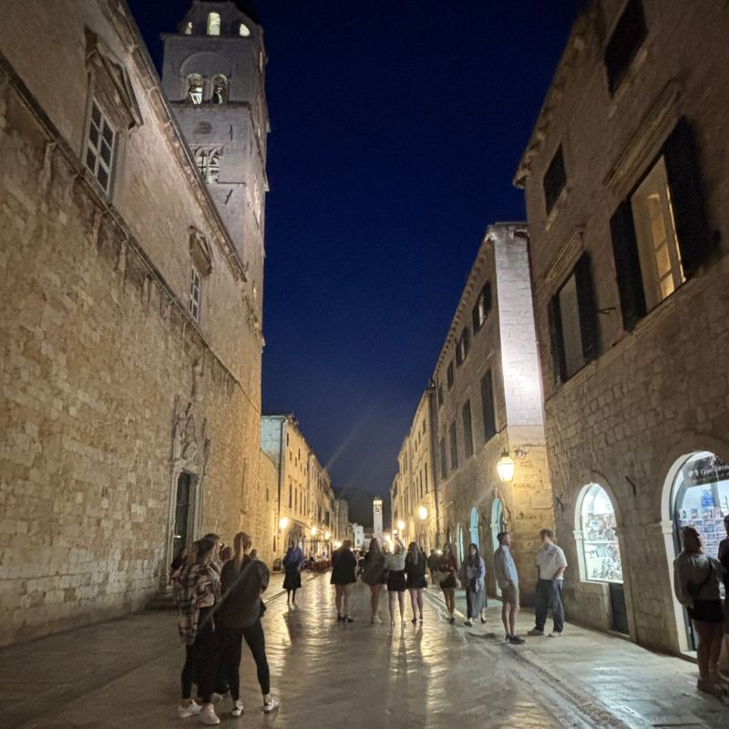 Evening view of Stradun, Dubrovnik's main pedestrian street, illuminated after sunset