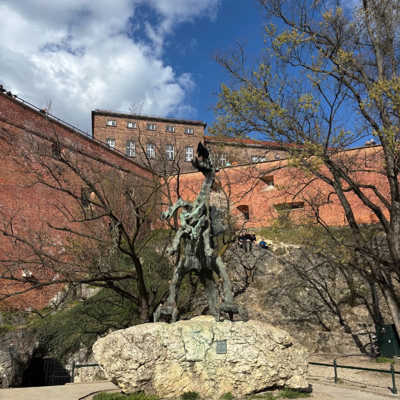 The Wawel Dragon statue beneath Wawel Castle in Kraków.