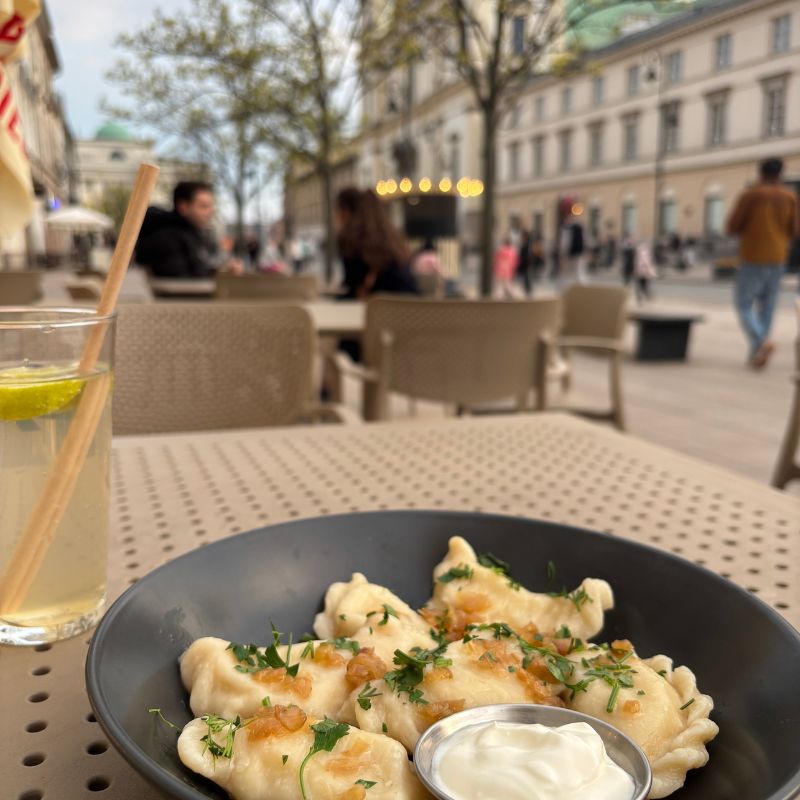 Polish pierogi served at an outdoor café in Warsaw's Old Town on a spring afternoon.