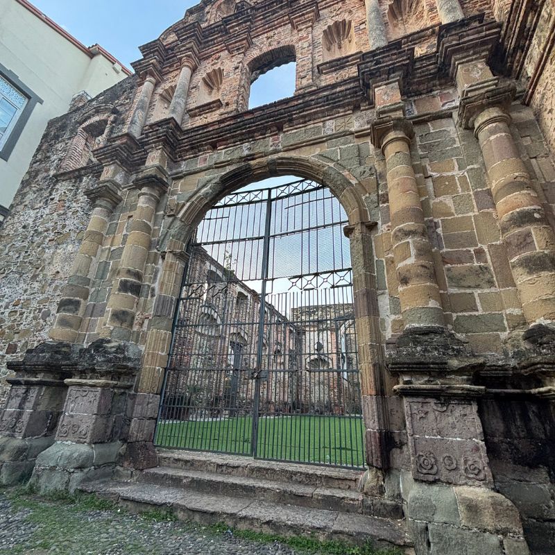 Historic stone ruins and arched entrance in Panama City’s Casco Viejo district.