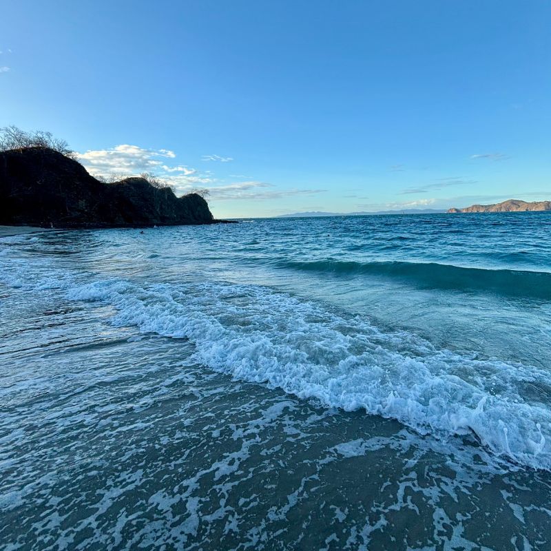 Gentle waves along the beach at Playa Hermosa in Guanacaste, Costa Rica.