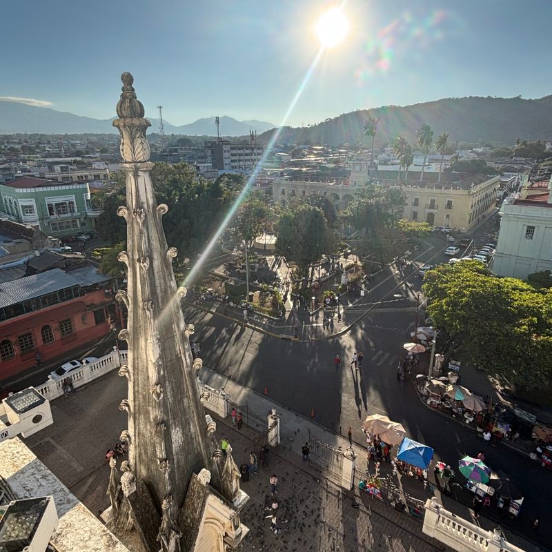 Panoramic view over downtown Santa Ana from the rooftop of Santa Ana Cathedral at sunset, El Salvador.