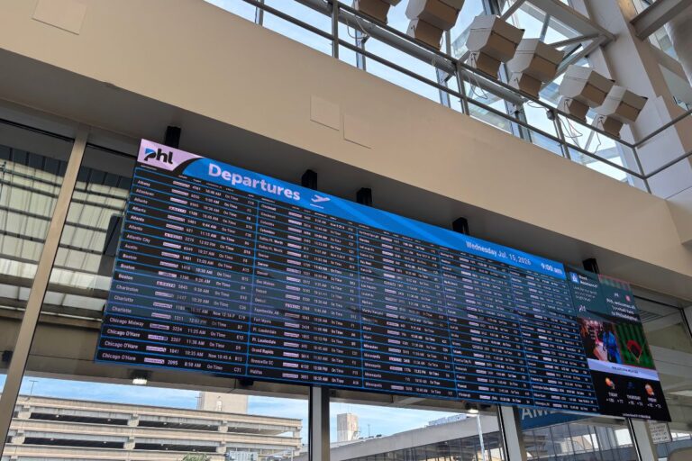 Departure board inside Philadelphia International Airport displaying flights from Terminal A, illustrating the starting point for building flexible one-way itineraries instead of traditional roundtrip bookings.