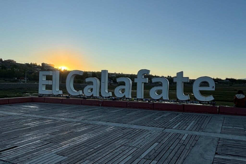 El Calafate landmark sign at sunset along the waterfront in Patagonia, Argentina.