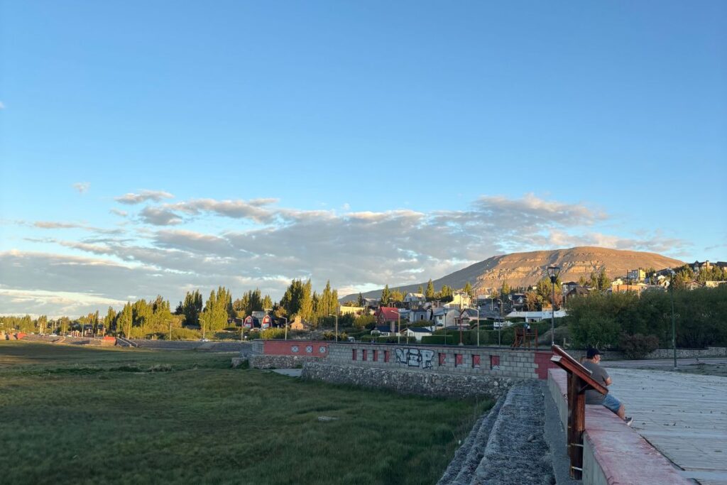 Waterfront promenade and mountain views at sunset in El Calafate, Patagonia, Argentina.