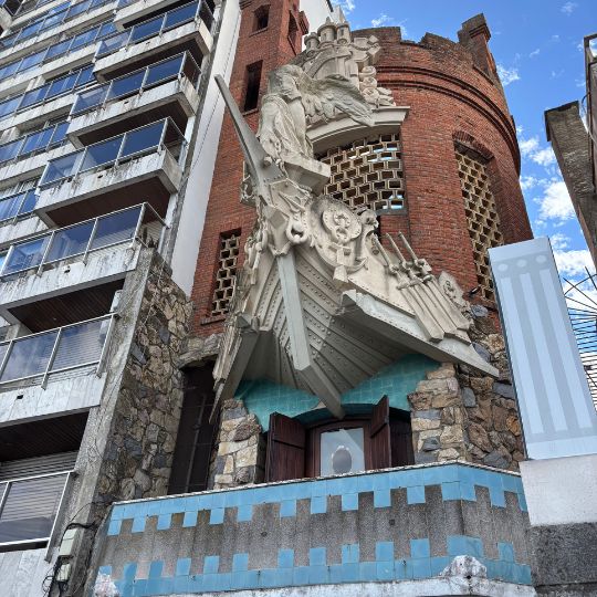 Entrance of Castillo Pittamiglio, a unique castle-like building in Montevideo known for its eclectic architecture and dragon sculpture.