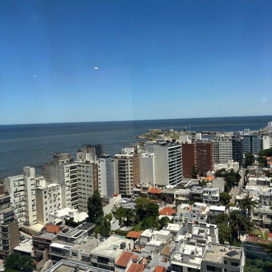 View of Montevideo's skyline and Río de la Plata from a high-rise observation deck.