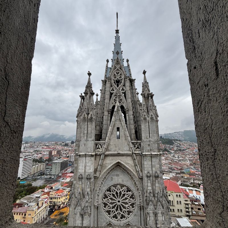 View of the Gothic towers of the Basilica del Voto Nacional overlooking Quito's Historic Center from one of the church's observation platforms.