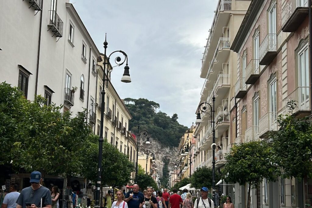 Pedestrian street lined with shops and buildings in Sorrento, Italy